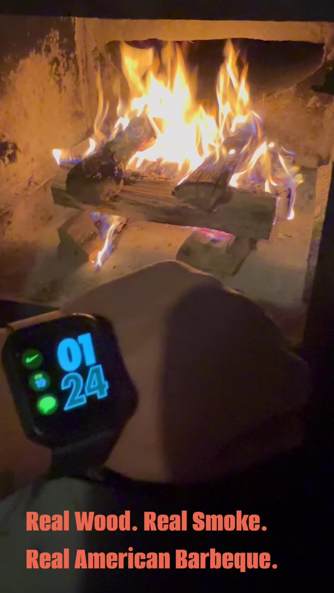 Live fire burning inside the smoker