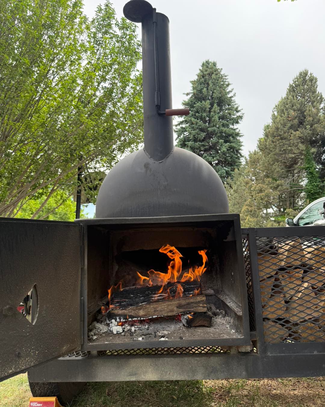 The smoker set up in a scenic Colorado valley