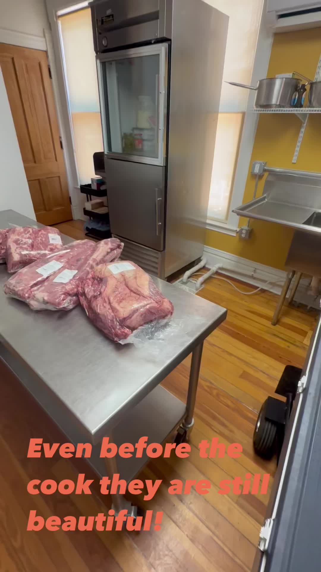 Raw meat cuts prepped next to the smoker